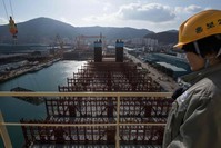 A view of the deck of an under-construction Maersk triple-E class container ship at the Daewoo DSME shipyard in Okpo.