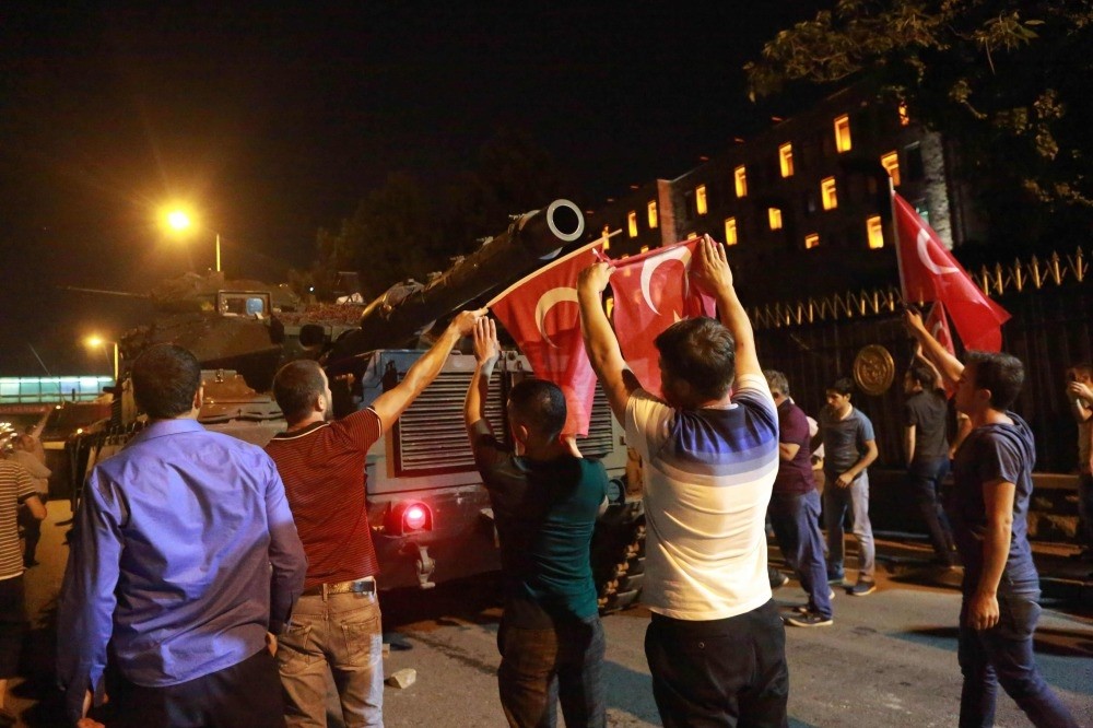 People stand up against tanks manned by coup troops in the capital Ankara. Adil u00d6ksu00fcz was captured in a main air base in the city after the coup attempt.