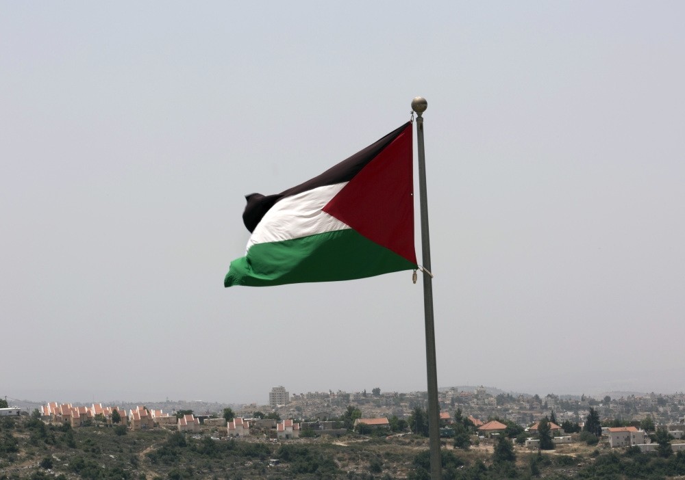 The Palestinian national flag flying from the highest point of the new West Bank Palestinian city of Rawabi, north of Ramallah, June 4, 2016.