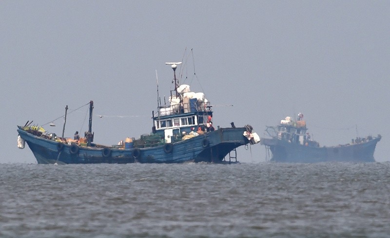  A handout picture made available by the by South Korean Defense Ministry, shows Chinese illegal fishing boats are seen in neutral waters near the inter-Korean, At Sea (EPA Photo)