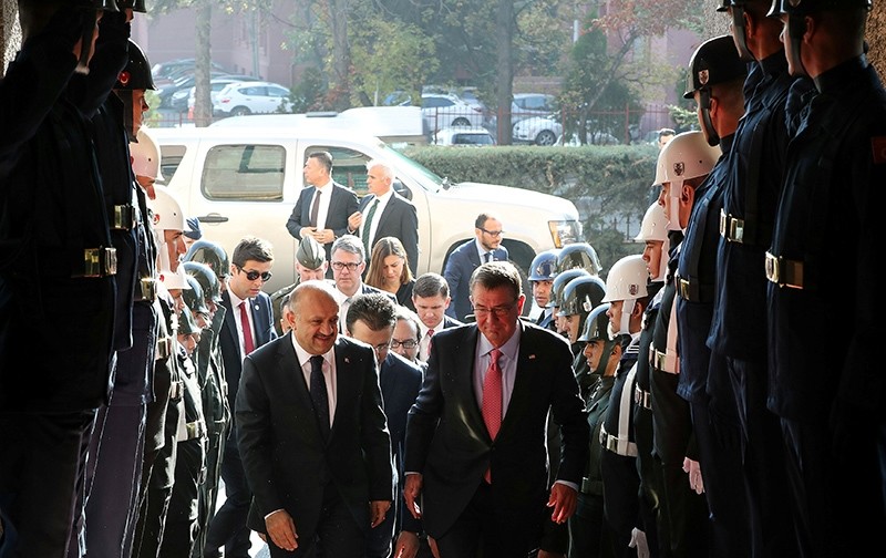  Defense Minister Fikri Iu015fu0131k (L) welcomes U.S. Defense Secretary Ash Carter upon his arrival to a meeting in Ankara, Turkey, October 21, 2016 (Reuters Photo)