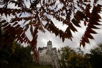 In this picture taken Oct. 9, 2016, Bran Castle lies on top of cliffs in Bran, Romania. (AP Photo)