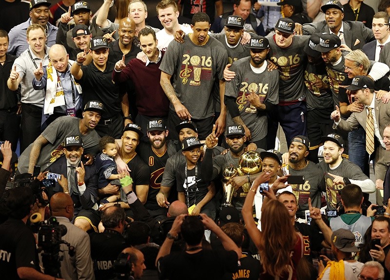 Cleveland Cavaliers pose for a team photo with the NBA Finals Championship Trophy after defeating the Golden State Warriors in NBA Finals game seven (EPA)