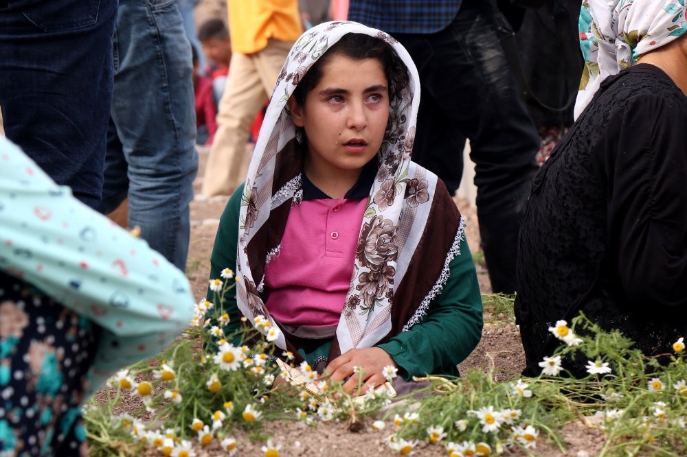 A family member of a victim mourns at a cemetery in Du00fcru00fcmlu00fc, the site of an explosion last week. 