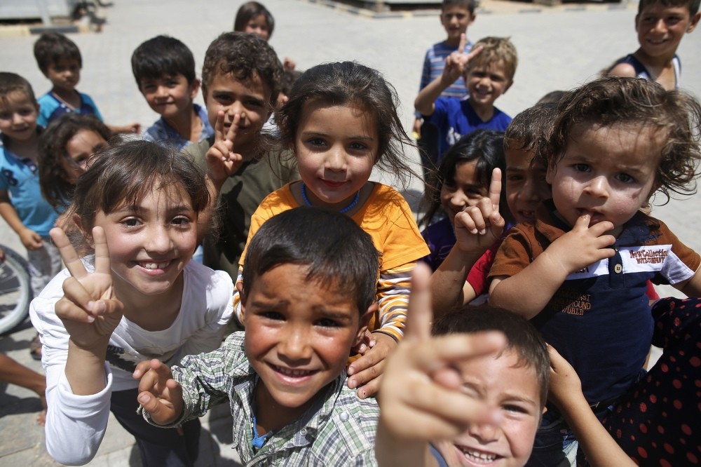 Children play at a Syrian refugee camp in u00d6ncu00fcpu0131nar in southeastern Turkey. Turkey hosts the largest number of refugees from the war-torn country.