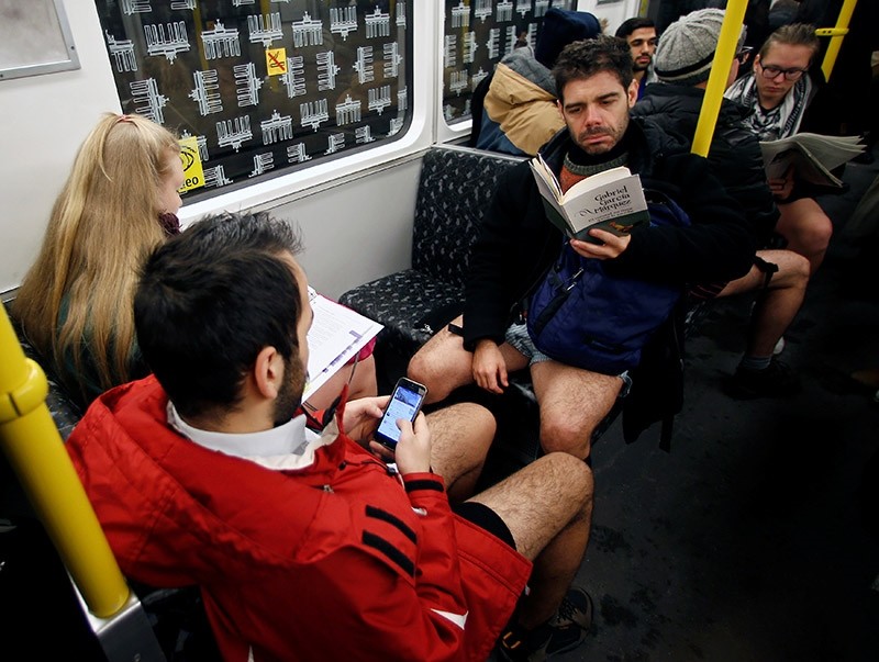 People take part in the annual 'No Pants Subway Ride' in Berlin, Germany, January 8, 2017. (Reuters Photo)