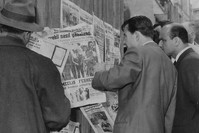 Citizens at a newsstand read of the arrest of Prime Minister Menderes after the coup in 1960.