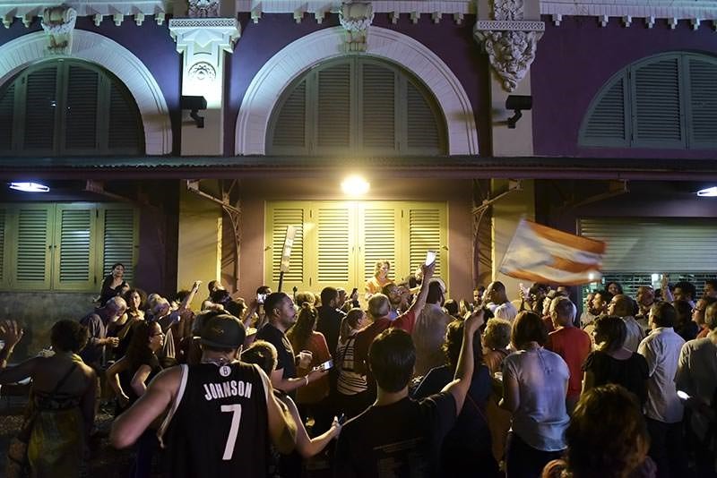 People celebrate after learning that President Barack Obama commuted the sentence for Puerto Rican nationalist Oscar Lopez Rivera, in San Juan, Puerto Rico (AP Photo)