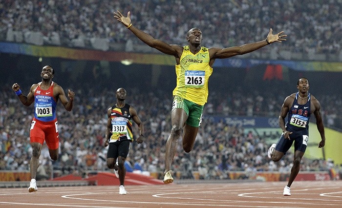 n this Aug. 20, 2008 file photo, Jamaica's Usain Bolt crosses the finish line to win the gold in the men's 200-meter final during the athletics competitions in the National Stadium at the Beijing 2008 Olympics in Beijing. (AP Photo)