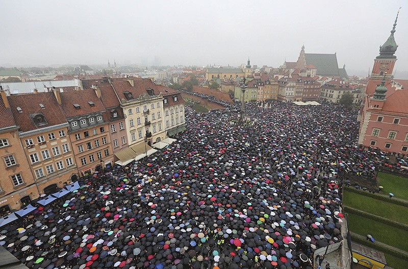 A sea of thousands of umbrellas of women and men participating in a nationwide Black Monday strike to protest a legislative proposal for a total ban on abortion, in downtown Castle Square is pictured in Warsaw, Poland, Oct. 3, 2016. (AP Photo)
