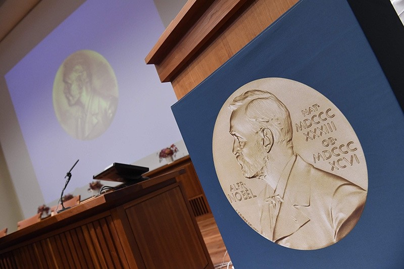 A portrait of Swedish inventor and scholar Alfred Nobel can be seen on the speaker's desk at the Nobel Forum in Stockholm, prior to the announcement of the Nobel Prize in Medicine on Oct. 3, 2016. (AFP Photo)