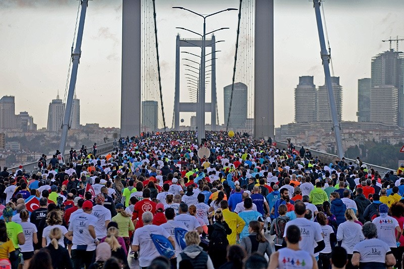 People participating in the 38th Vodafone Istanbul Marathon on the July 15 Martyrs Bridge (formerly known as the Bosporus Bridge), October 13, 2016 (IHA Photo)