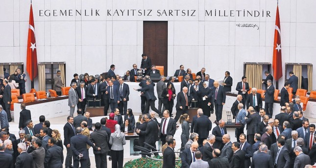Turkish lawmakers casting their votes during a session debating the reform of the Constitution at the Turkish Parliament in Ankara.