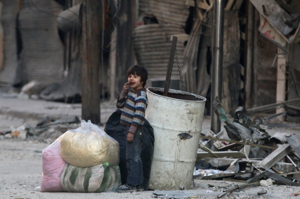 A boy standing amid the damage in the moderate-held al-Shaar neighborhood of Aleppo, Syria, Nov. 23, 2016.