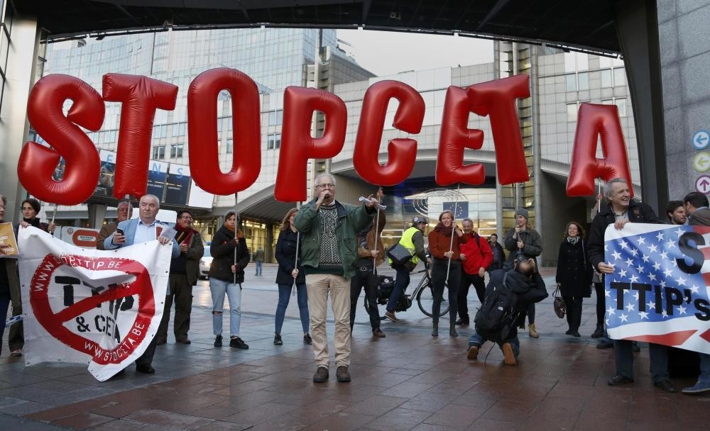 Demonstrators protest against CETA outside an EU summit in Brussels, Belgium.