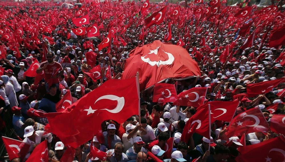 People waving flags during a democracy rally to protest the failed July 15 coup attempt that killed 240 people including civilians, police officers and soldiers, Aug. 7, Istanbul. 