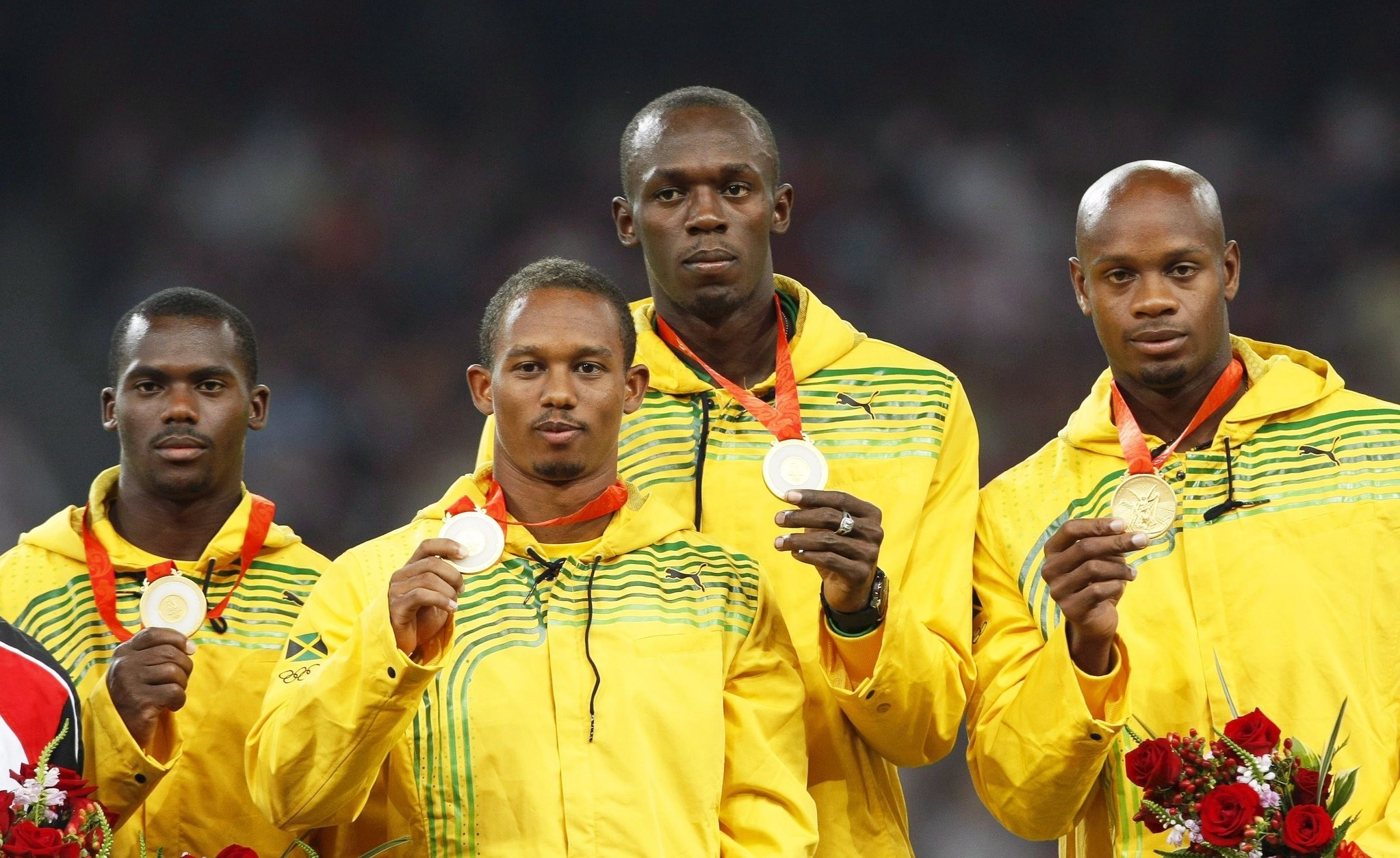 A file picture dated 23 August 2008 of Jamaica's (L-R) Nesta Carter, Michael Frater, Usain Bolt, and Asafa Powell posing with their gold medals. (EPA Photo)