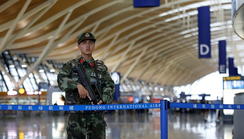 A paramilitary policeman guards near the site of a blast at a terminal in Shanghai's Pudong International Airport, China, June 12, 2016 (Reuters Photo)
