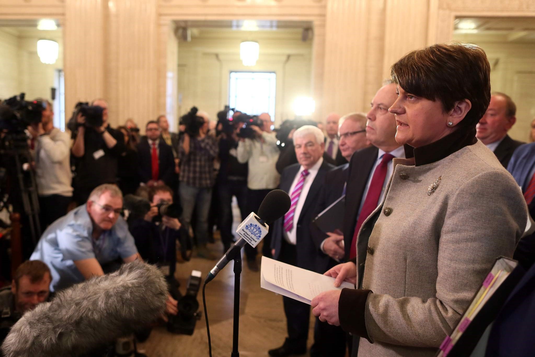 Democratic Unionist Party leader Arlene Foster, speaks to members of the media in the Great Hall at Stormont before the start of the Assembly in Belfast, Northern Ireland. (AFP Photo)