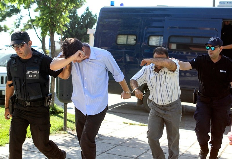 Two of eight Turkish soldiers who fled to Greece in helicopter and requested political asylum after a failed military coup, are brought to prosecutor in Alexandroupolis, Greece July 17, 2016.  REUTERS Photo