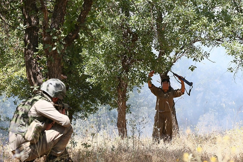 A PKK terrorist surrenders to Turkish soldiers in Lice, Diyarbaku0131r, southeastern Turkey in July 2016. (Sabah Photo)