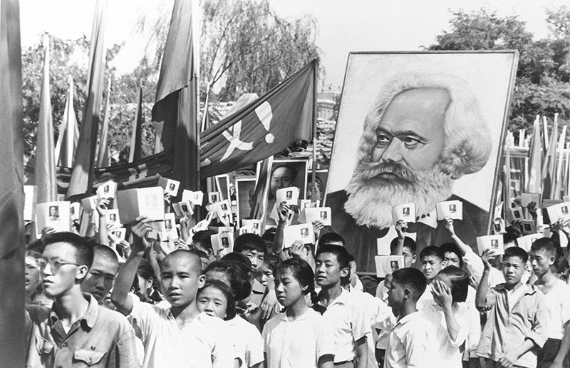 In this Sept. 14, 1966 file photo, youths are seen at a rally during the height of the Red Guard upheaval carrying a poster of Karl Marx (AP Photo, File)