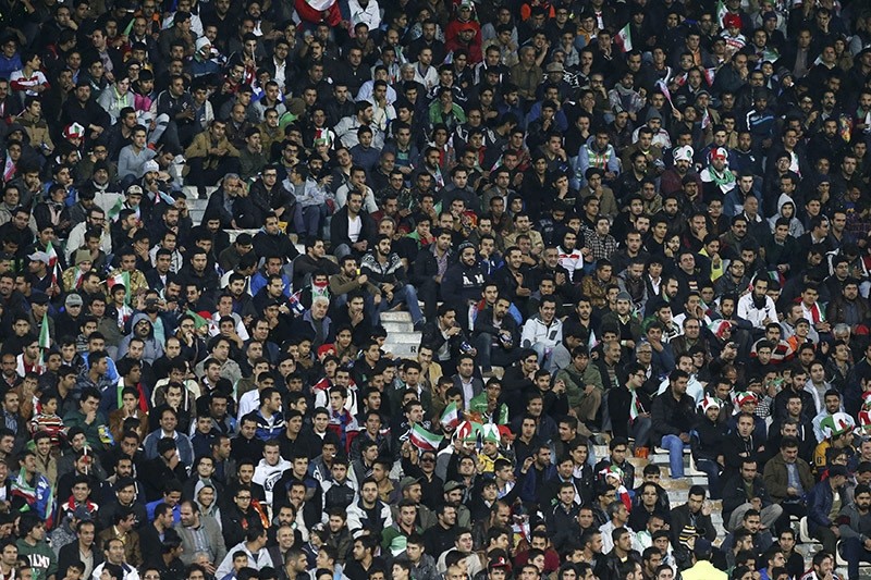 Iranian soccer fans follow a friendly match of Iran. 2014. (AP Photo)