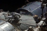 This NASA TV video grab shows US astronaut Kate Rubins viewed near the docking port on August 19, 2016 at the International Space Station. (AFP Photo / NASA TV)