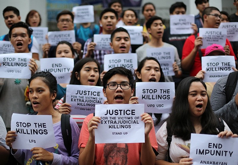 Filipino student activists shout slogans as they call for justice for victims of extrajudicial killings during a rally at the University of the Philippines in suburban Quezon city, north of Manila, Philippines, Thursday Aug. 11, 2016. (AP Photo)