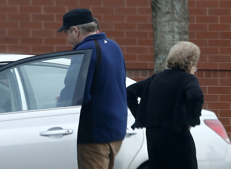 John Hinckley Jr., left, gets into his mother's car in front of a recreation center in Williamsburg, Va. The man who shot President Ronald Reagan left a Washington mental hospital for good on Saturday Sept. 10, 2016. (AP Photo)