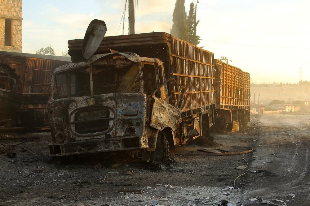 Damaged aid trucks hit by a deadly airstrike in the moderate-held town of al-Kubra, western Aleppo city of Syria, Sept. 20, 2016.