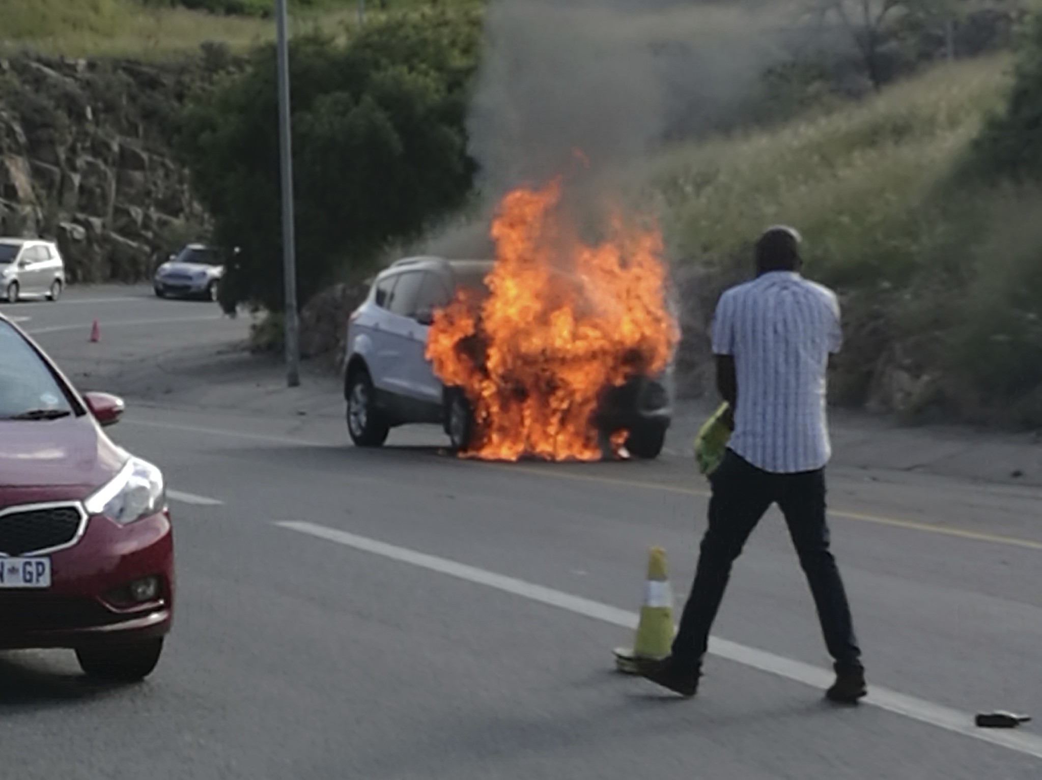 In this photo taken Thursday, Jan. 12, 2017 the 2013 Ford Kuga owned by Warren Krog burns out in Alberton Johannesburg. (AP Photo)
