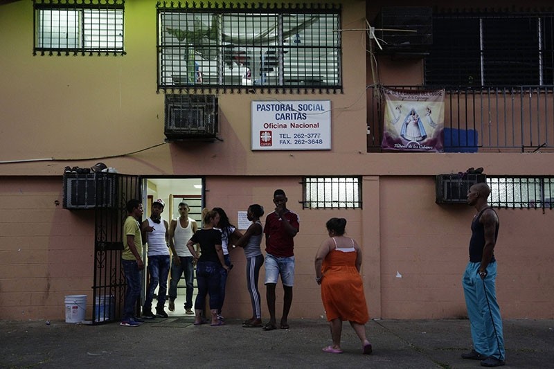 Cuban migrants, many who are traveling to the U.S., stand outside a shelter in Panama City, Thursday, Jan. 12, 2017. (AP Photo)