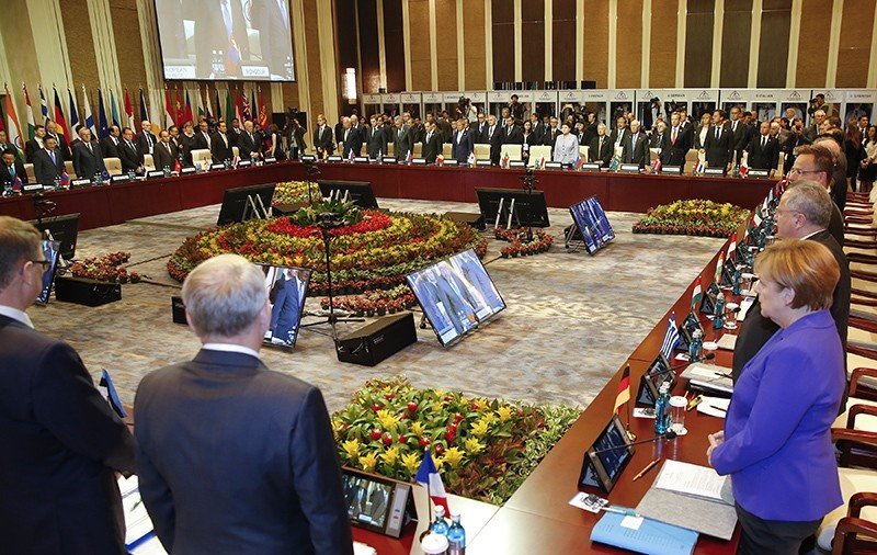 Leaders stand for a minute of silence for the victims of a deadly attack in the French city of Nice, before the opening session of the Asia-Europe Meeting (ASEM) summit in Ulaanbaatar, Mongolia (AP Photo)