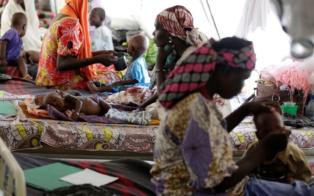Nigerian women feed their malnourished children at a feeding center run by Doctors Without Borders in Maiduguri, Nigeria on Aug. 29.