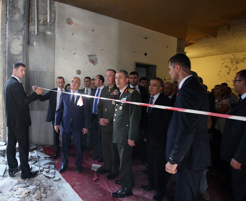 US Chief of Staff Dunford (left in uniform), accompanied by Turkish Chef of Staff Hulusi Akar (right in uniform) inspects the damage at Turkey's Parliament in Ankara on August 1. (IHA Photo)