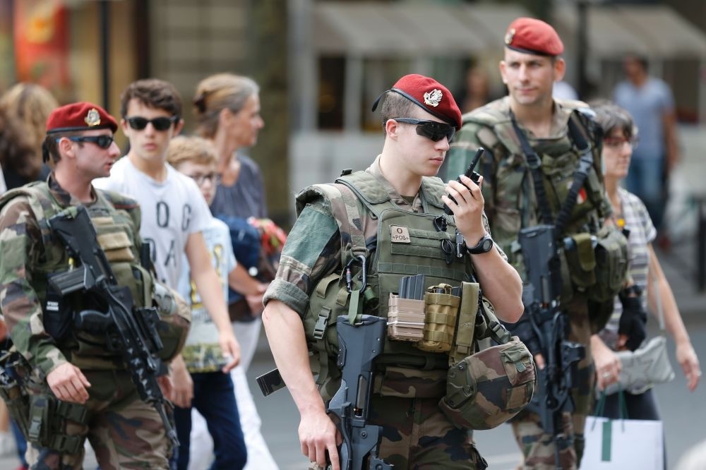 French soldiers patrol near the Galeries Lafayette in Paris on July 15.