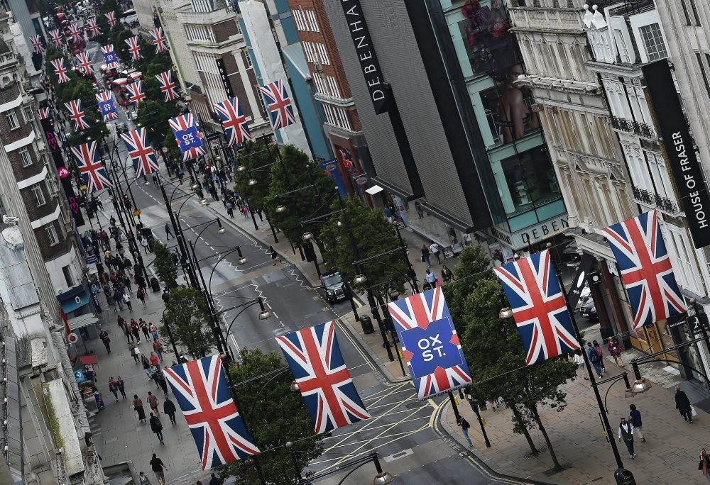 Union flags hang over Oxford Street in London on Wednesday as Britain's economy grew by 0.6 percent in the run up to the Brexit vote. Signals since the Brexit vote, however, indicate that the economy is slowing and could fall into recession.
