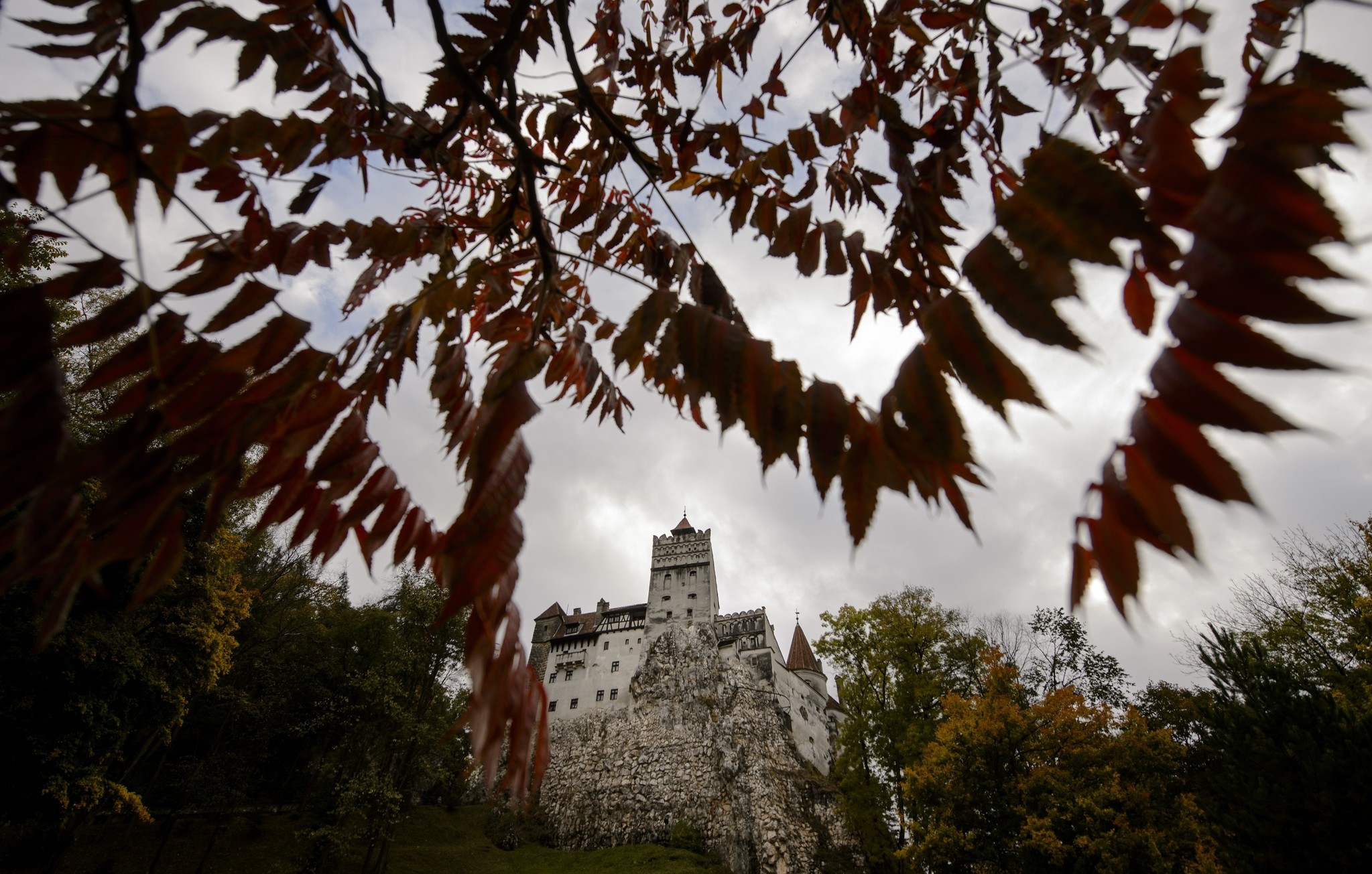 In this picture taken Oct. 9, 2016, Bran Castle lies on top of cliffs in Bran, Romania. (AP Photo)