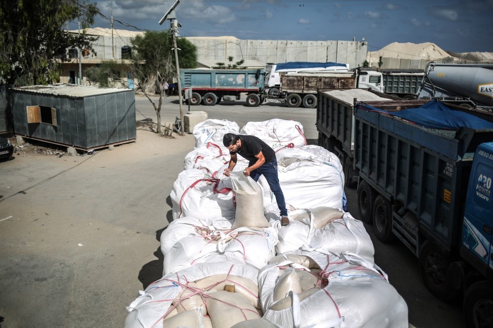 Trucks carrying aid gradually arrive in Gaza where a blockade restricted access to food and other vital goods.