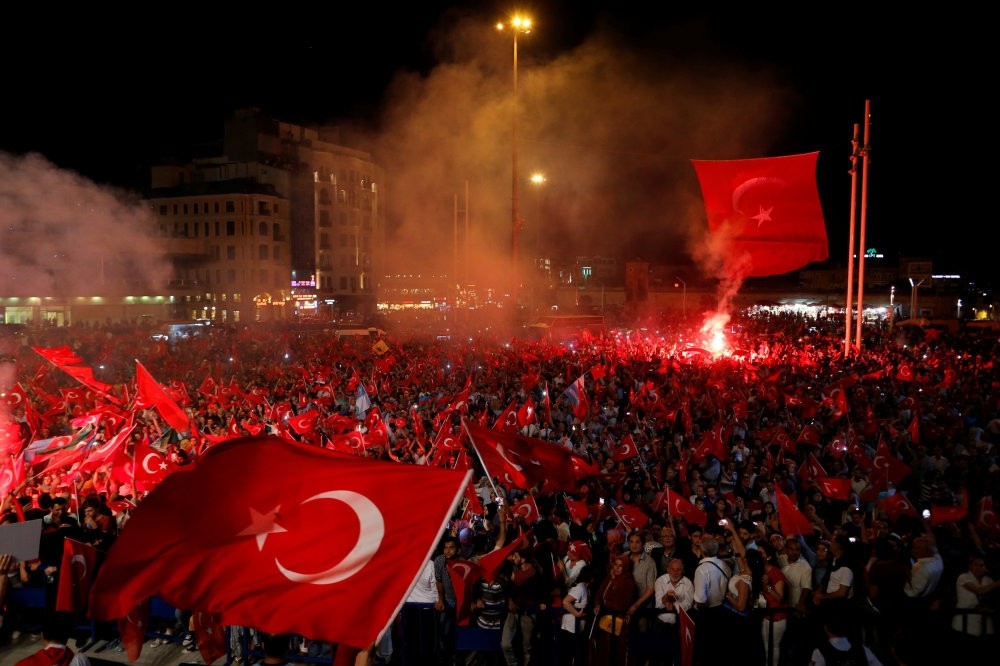 People waving Turkish flags during a demonstration against the failed coup attempt, Taksim Square, Istanbul, July 18.