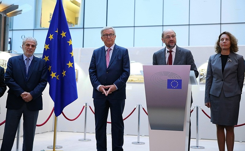 President of the European Parliament Martin Schulz (2nd R) speaks during the opening of a photo exhibition 'The missing lives of Cyprus' in Brussels, Belgium (AA Photo)