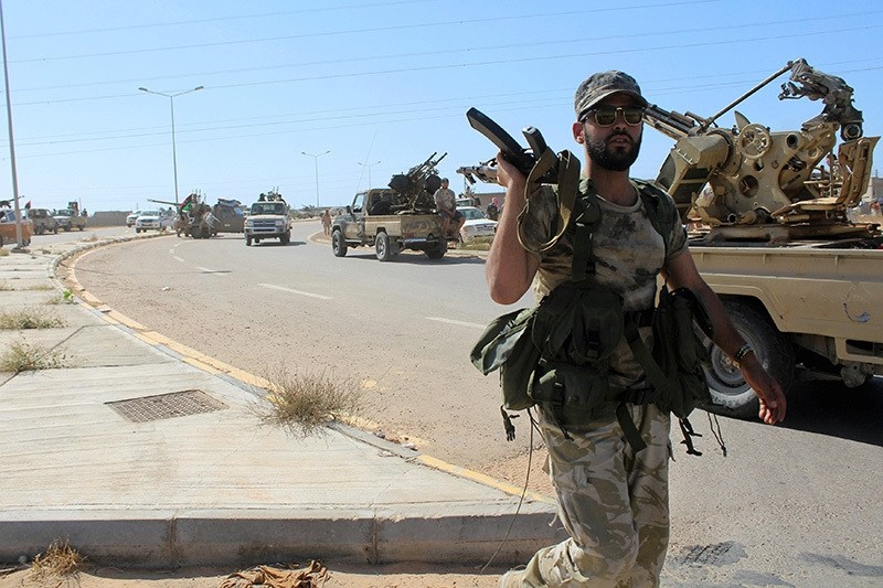 Forces aligned with Libya's new unity government advance along a road in Daesh stronghold of Sirte, June 8, 2016. (Reuters Photo)