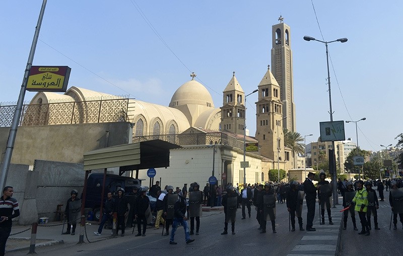 Egyptian security forces gather at the site of an explosion at the Saint Mark's Coptic Orthodox Cathedral on December 11, 2016 in the Abbasiya neighbourhood in the capital Cairo (AFP Photo)