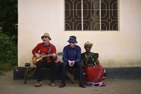 Albino singer King Shube (L) plays a guitar on Ukerewe Island.