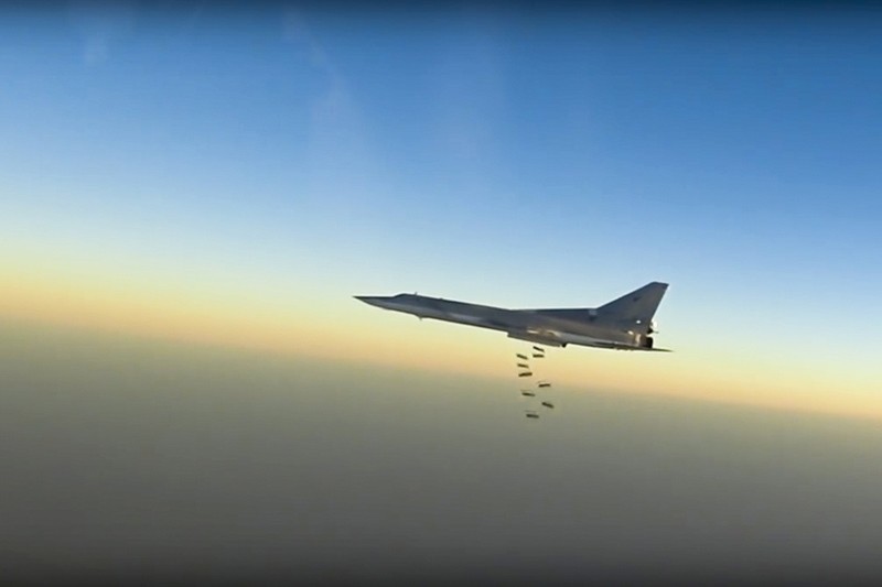 In this frame grab from video provided by the Russian Defence Ministry Press Service, Russian long range bomber Tu-22M3 flies during a strike above an undisclosed location in Syria (AP Photo)