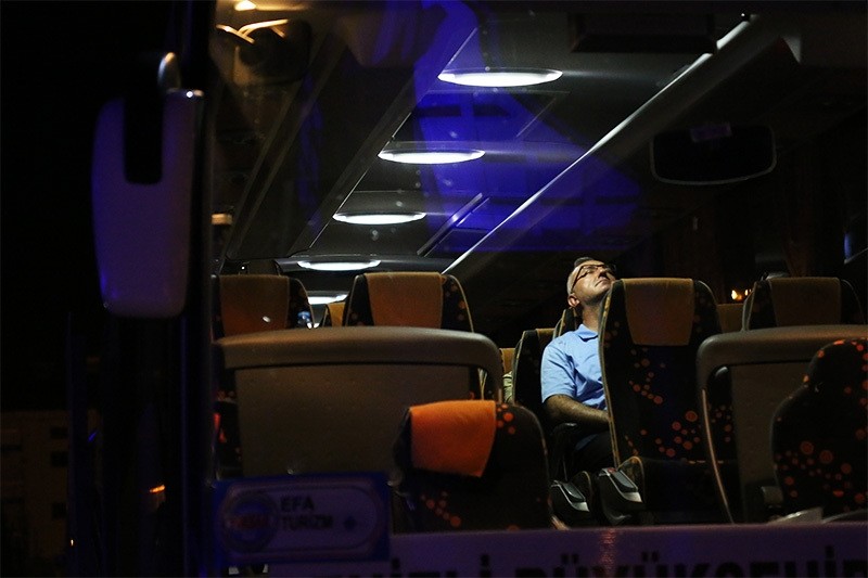 Major General Kamil u00d6zhan u00d6zbaku0131r, commander of the Denizli garrison and the 11th Commando Brigade, sits in a bus as he is arrested along with 51 soldiers. (AA Photo)
