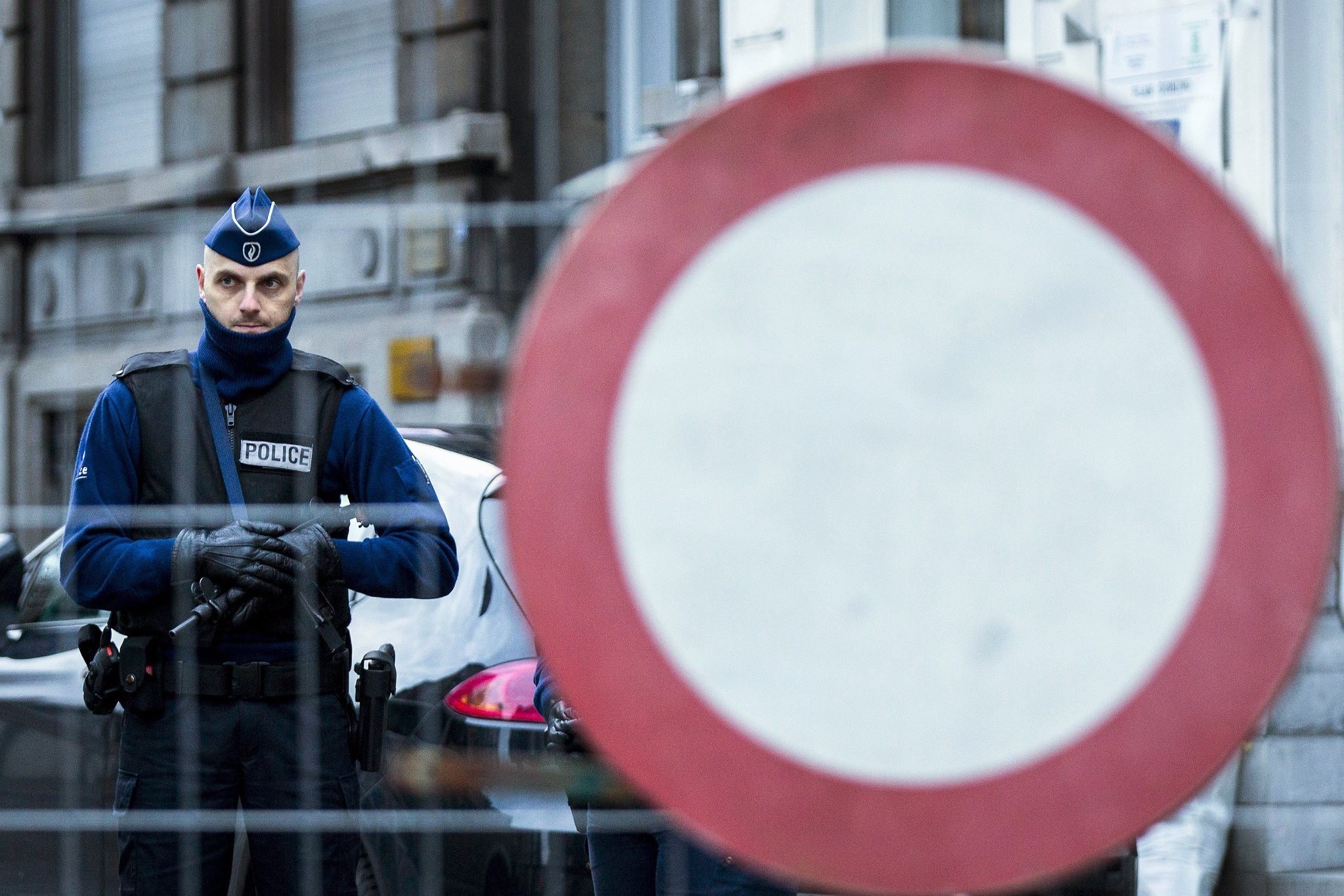 A policeman stands guard at Colline street in Verviers, eastern Belgium during last year's anti-terror operations (AFP Photo)
