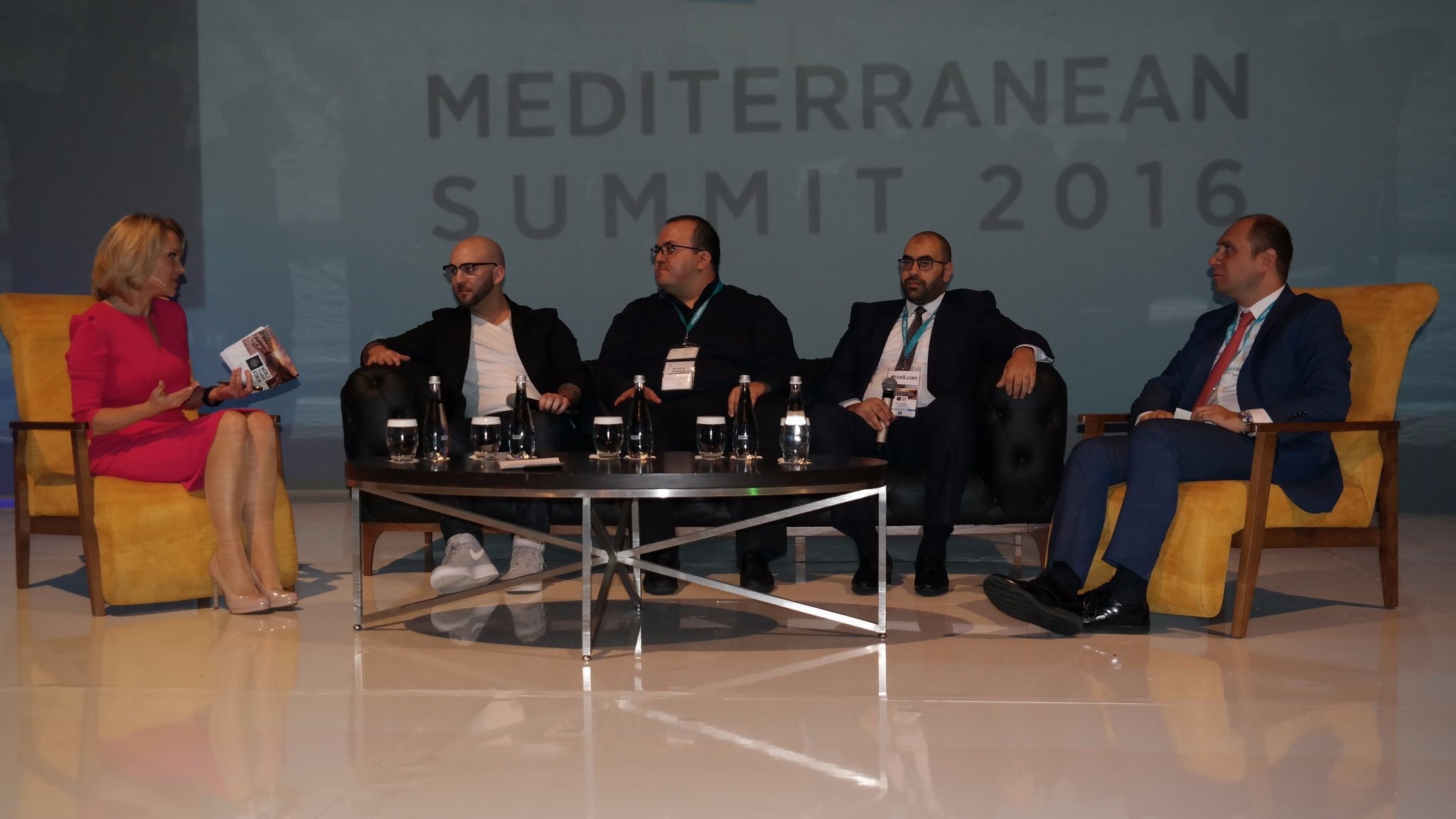 K. Madera (L) of BBC World News moderates the u201cMulti-Channel Usage of Tourismu201d session in which W. Isbrucker (Booking), E. u00c7elik (Head of Sales Facebook), B. Badr (Attar Travel), & A. u0130u015fbulan (Gen. Manager TAV Op. Serv.) speak (from left to right).