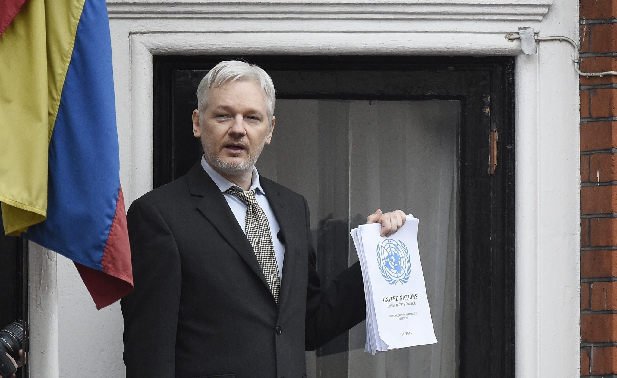 A file picture dated 05 February 2016 shows Julian Assange speaking to the media from a balcony of the Ecuadorian Embassy in London, Britain. (EPA Photo)